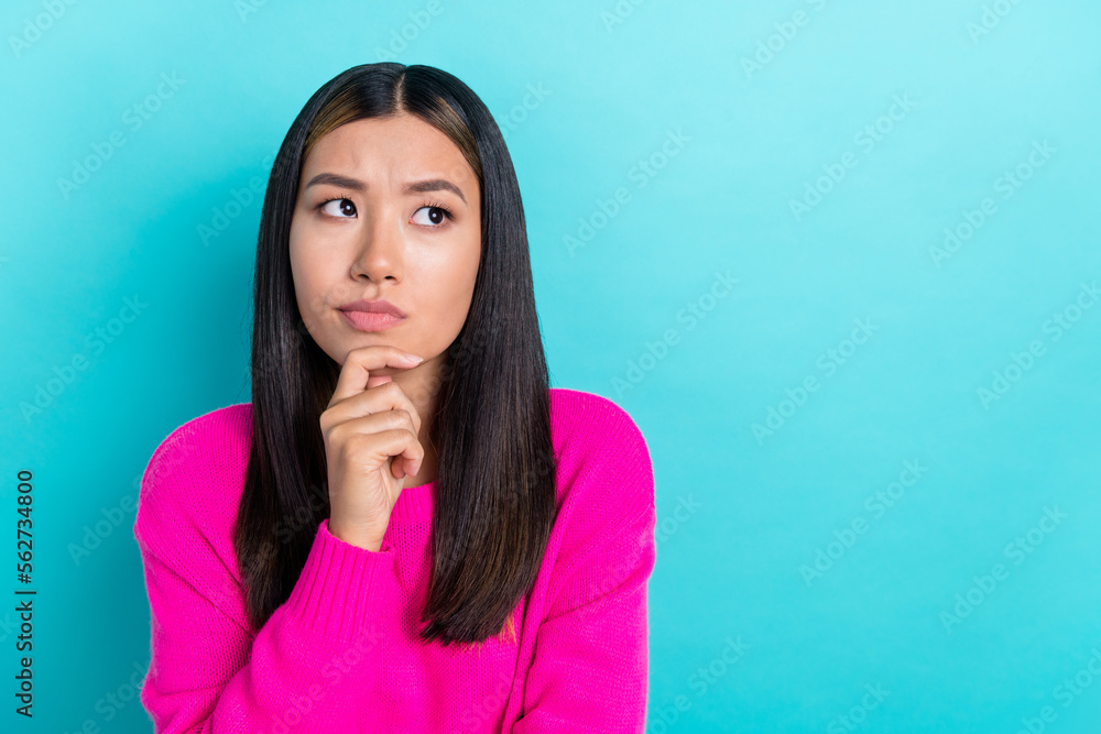 Photo of minded lady wear stylish pink clothes hand chin look empty space dilemma decision solve problem isolated on cyan color background Photo of minded lady wear stylish pink clothes hand chin look empty space dilemma decision solve problem isolated on cyan color background