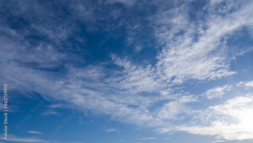 Sunbeams among white clouds in blue sky. sky background Sunbeams among white clouds in blue sky. sky background