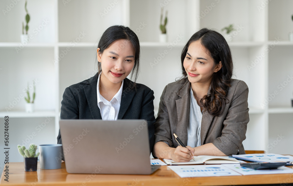 Business idea creative brainstorming sessions for projects Strategic topic of two Asian girls working together data analysis Happy clarification of various financial information at the desk. Business idea creative brainstorming sessions for projects Strategic topic of two Asian girls working together data analysis Happy clarification of various financial information at the desk.