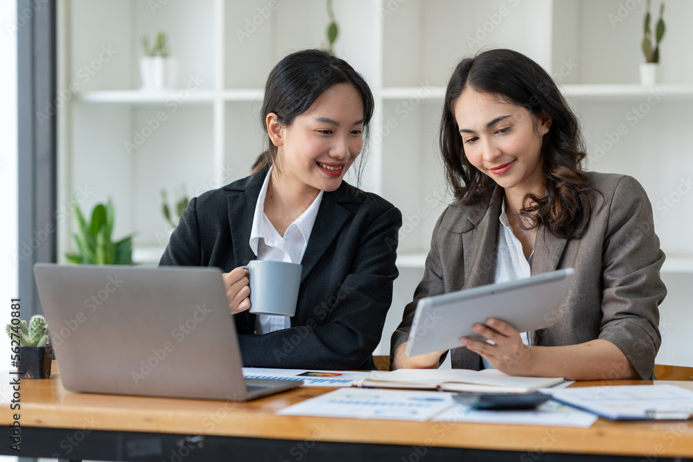 Business idea creative brainstorming sessions for projects Strategic topic of two Asian girls working together data analysis Happy clarification of various financial information at the desk. Business idea creative brainstorming sessions for projects Strategic topic of two Asian girls working together data analysis Happy clarification of various financial information at the desk.