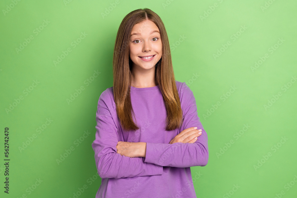 Photo of adorable positive lady wear purple clothes arm crossed good mood isolated on green color background Photo of adorable positive lady wear purple clothes arm crossed good mood isolated on green color background