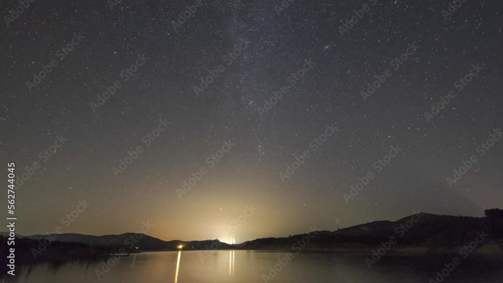 Starry sky over calm river Starry sky over calm river