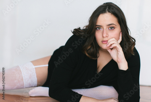 Woman in stockings on floor photo