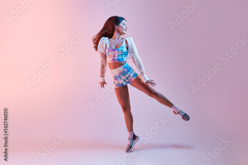 Fit woman dancing in studio