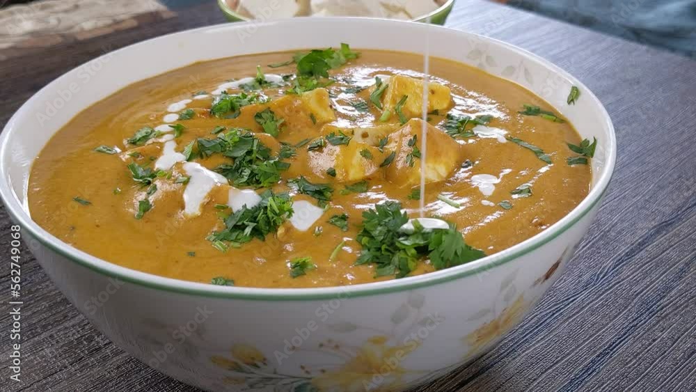 Paneer butter masala garnishing with heavy whipping cream home made