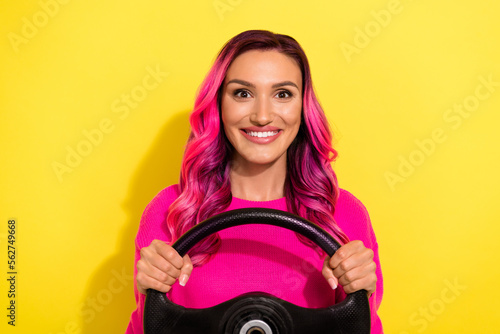 Photo of positive youngster lady ride steering wheel automotive travel road trip isolated on bright color background
