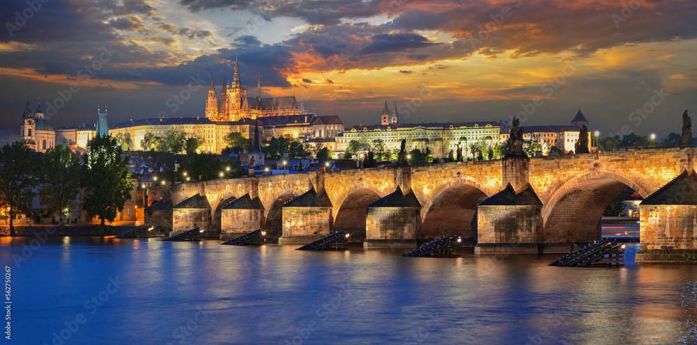 Panorama of the Vltava river, Charles Bridge and St. Vitus Cathedral in Prague in the evening. Karluv Most, Prazsky hrad. Czech Republic.