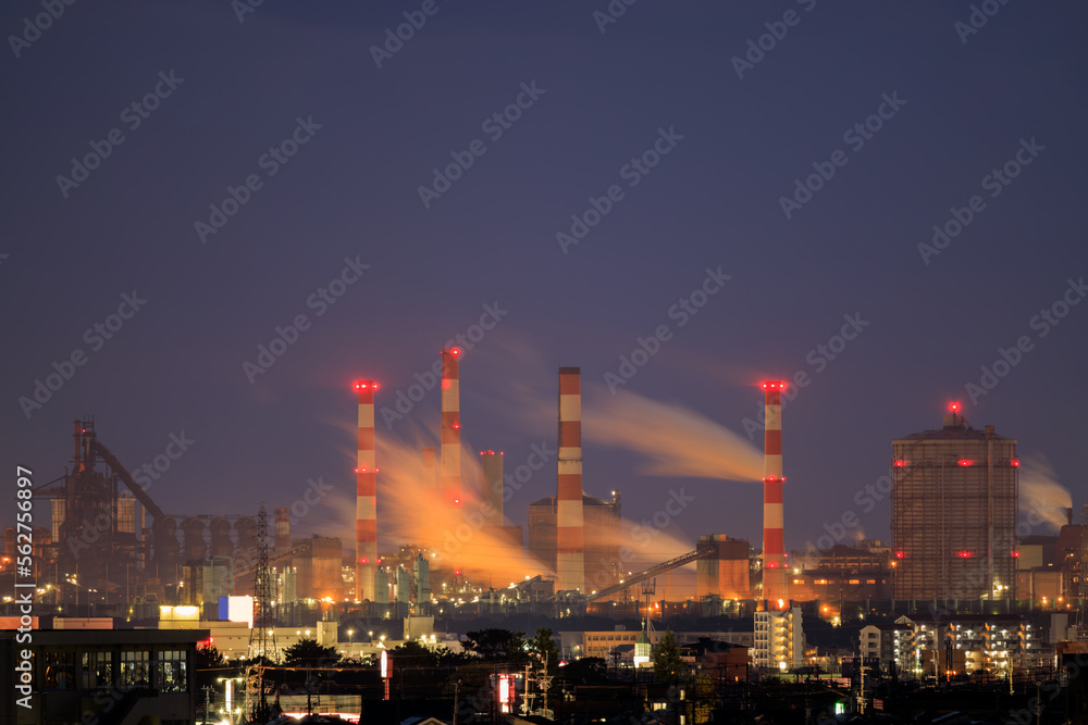 Gas emissions from industrial facility in residential area at night