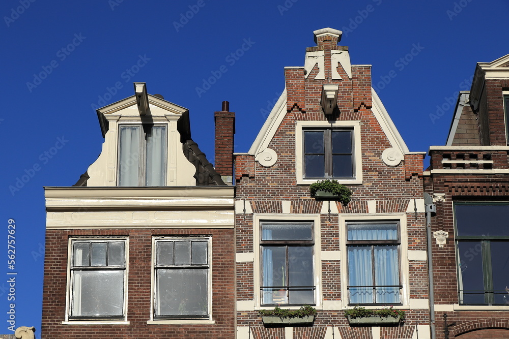 Amsterdam Bloemgracht Canal House Facades Close Up with Bright Blue Sky, Netherlands Amsterdam Bloemgracht Canal House Facades Close Up with Bright Blue Sky, Netherlands