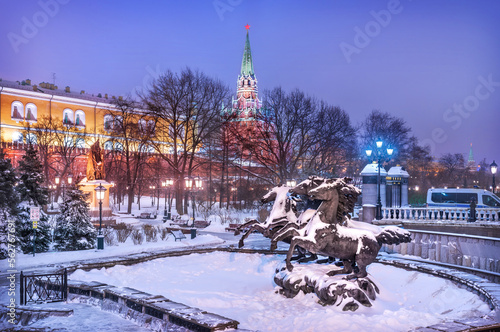 Sculpture of horses in the Alexander Garden and the Kremlin at winter night, Moscow photo