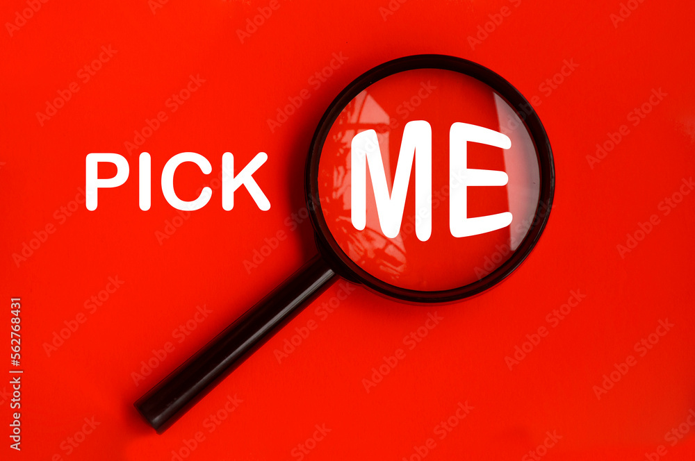 Pick me text on red background with magnifying glass. Hiring concept Pick me text on red background with magnifying glass. Hiring concept