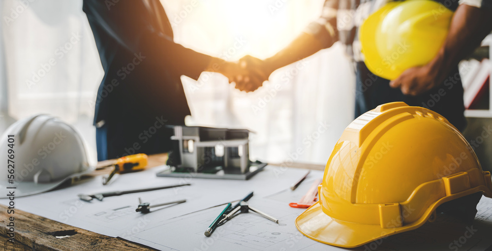 engineering team shaking hands start planning for architecture Engineer sketching construction project concept with architect equipment Consult about their construction project. engineering team shaking hands start planning for architecture Engineer sketching construction project concept with architect equipment Consult about their construction project.