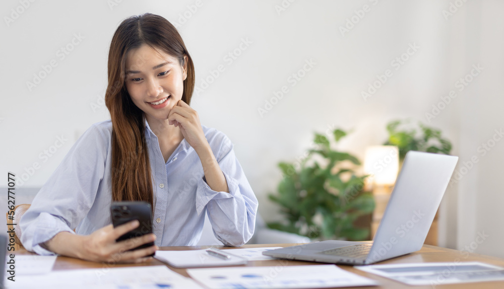 Woman working at home, Attractive woman chatting or talking with colleague on mobile phone at her home, Work for home, Remote conversation or meeting , Stay home, Use a cell phone or smartphone. Woman working at home, Attractive woman chatting or talking with colleague on mobile phone at her home, Work for home, Remote conversation or meeting , Stay home, Use a cell phone or smartphone.
