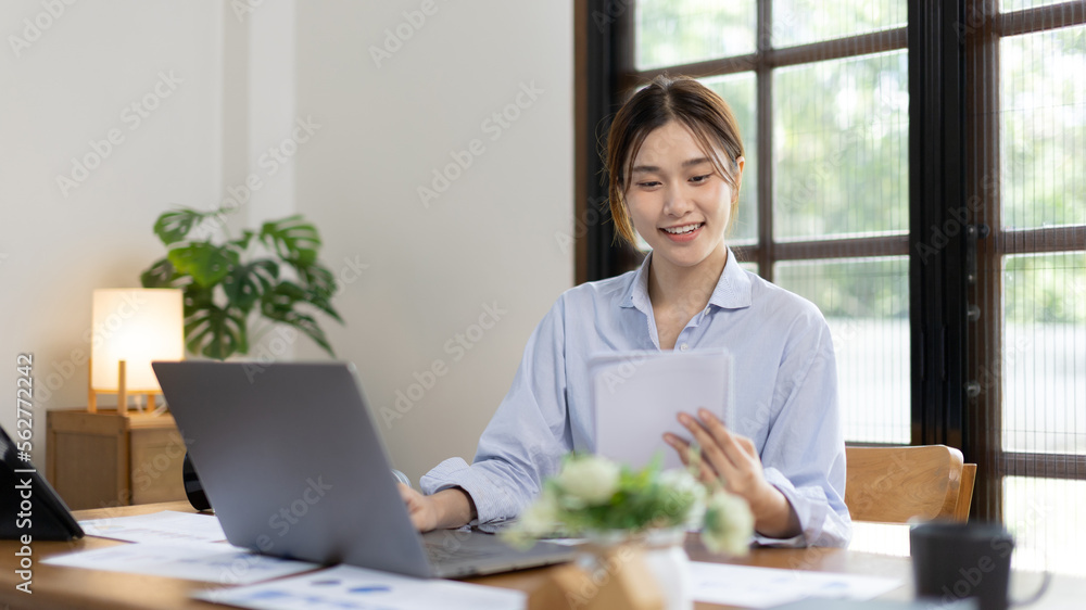 Work from home, College student is analyzing data or doing homework assignments in her house, Use your laptop to search for information and educate yourself at home, Stay home, Internet learning. Work from home, College student is analyzing data or doing homework assignments in her house, Use your laptop to search for information and educate yourself at home, Stay home, Internet learning.