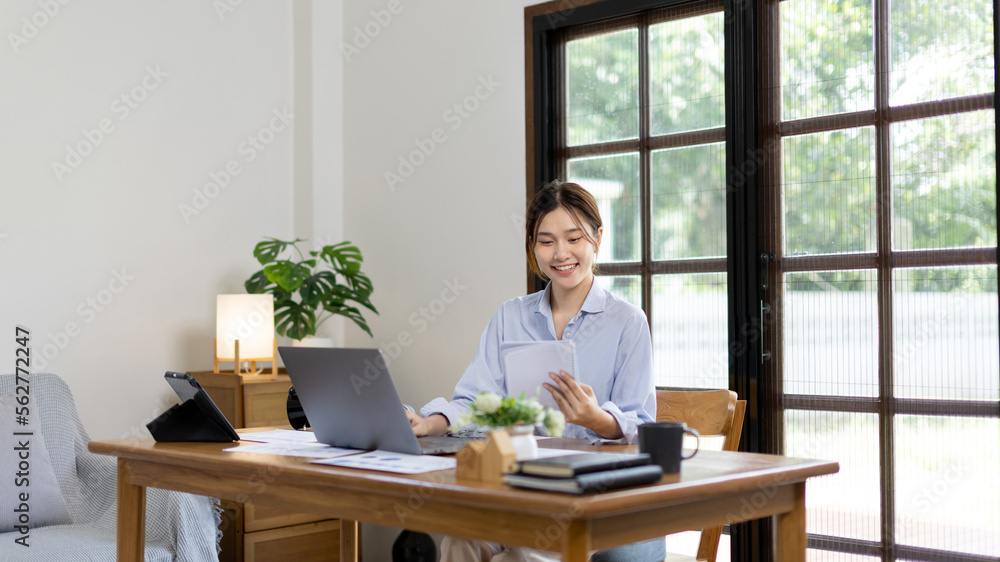 Work from home, College student is analyzing data or doing homework assignments in her house, Use your laptop to search for information and educate yourself at home, Stay home, Internet learning. Work from home, College student is analyzing data or doing homework assignments in her house, Use your laptop to search for information and educate yourself at home, Stay home, Internet learning.