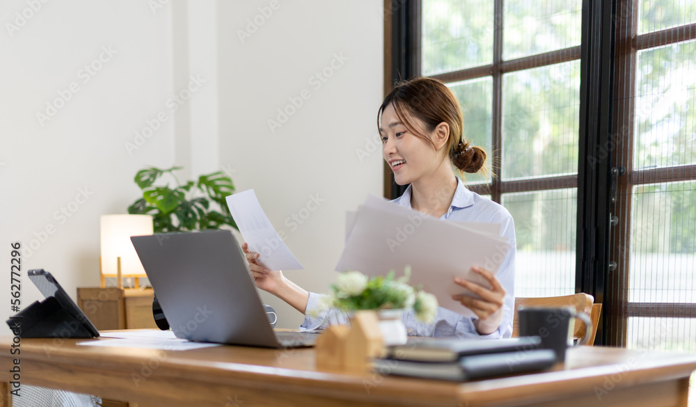 Work from home, College student is analyzing data or doing homework assignments in her house, Use your laptop to search for information and educate yourself at home, Stay home, Internet learning. Work from home, College student is analyzing data or doing homework assignments in her house, Use your laptop to search for information and educate yourself at home, Stay home, Internet learning.