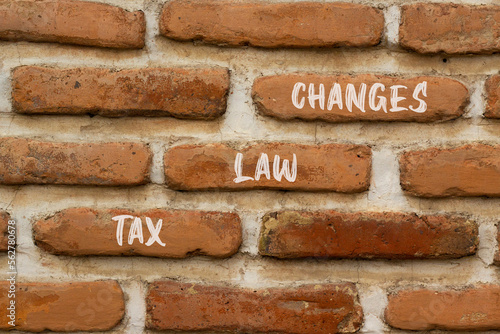 Tax law changes symbol. Concept words Tax law changes on red brown brick wall on a beautiful brick wall background. Business tax law changes concept. Copy space.