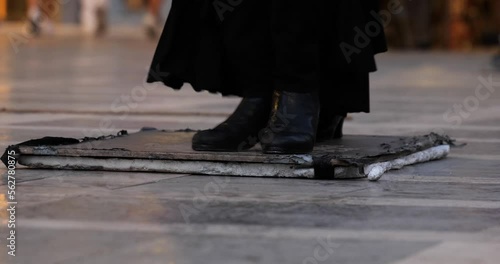 People playing and dancing traditional flamenco music in the city center of Granada in Spain. Street live music. Energetic rhythm of music.