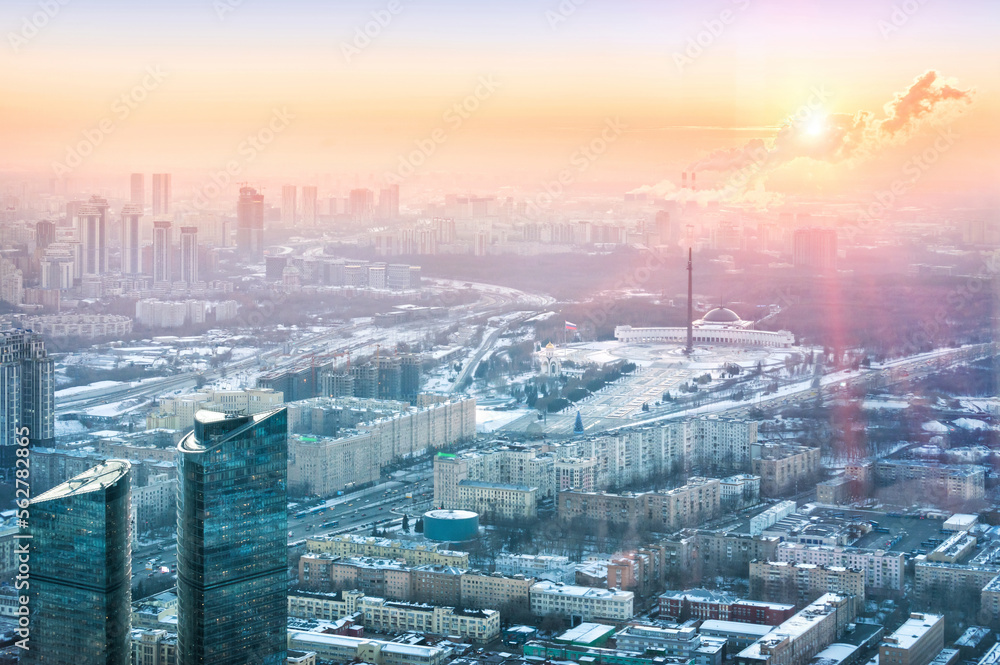 Fototapeta premium View of the city from the observation deck on skyscrapers in the setting sun, Poklonnaya Gora and Victory Park, Moscow City
