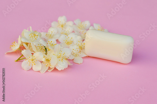 Mock up soap with flowers on pink background