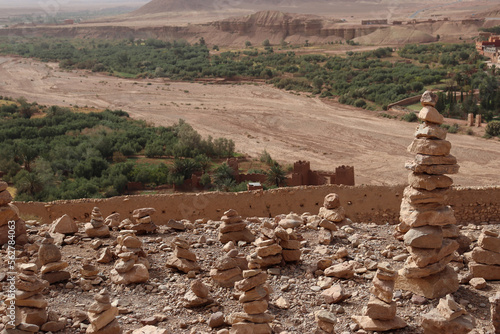 Piles of stones stacked in Ait Ben Haddou, famous kasbah in Morocco photo