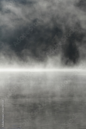 Misty nature background of mountain lake