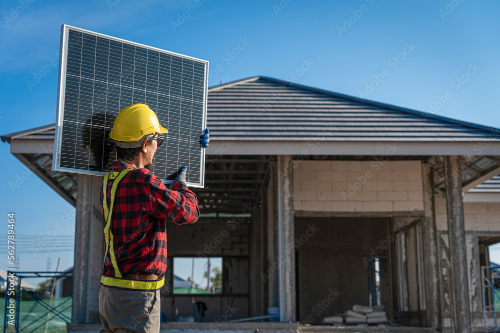 New technology and solar panels The supervisor is installing solar panels on the roof of the house. New technology and solar panels The supervisor is installing solar panels on the roof of the house.