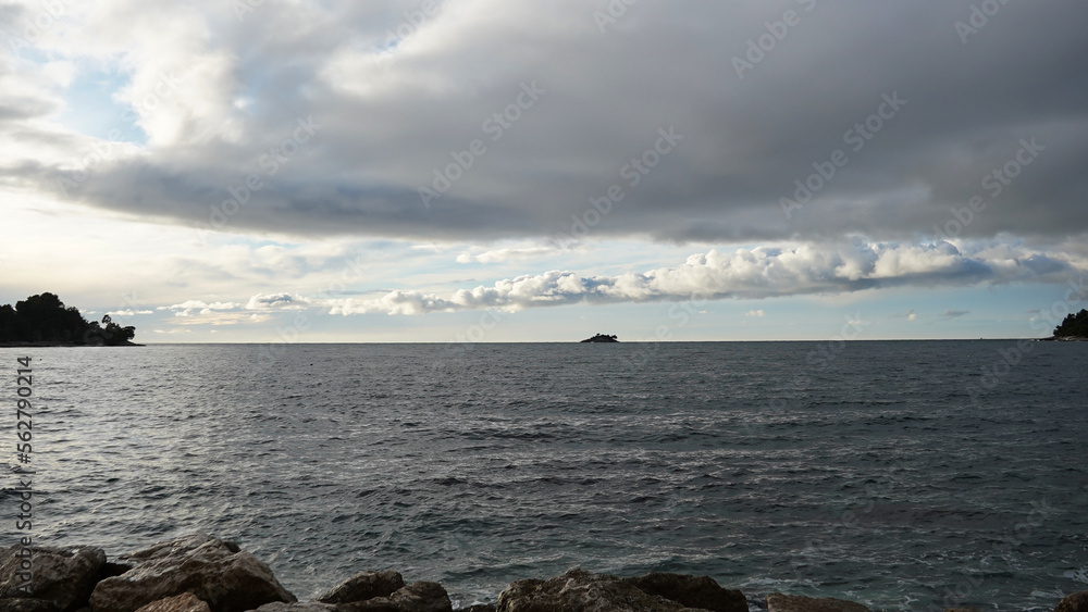 Dramatic stormy cloudy sky over sea, natural photo background   