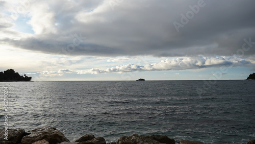 Dramatic stormy cloudy sky over sea, natural photo background    © Cocosss