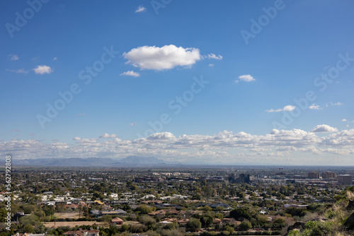 Mountains over desert city phoenix arizona cumulus clouds in the background