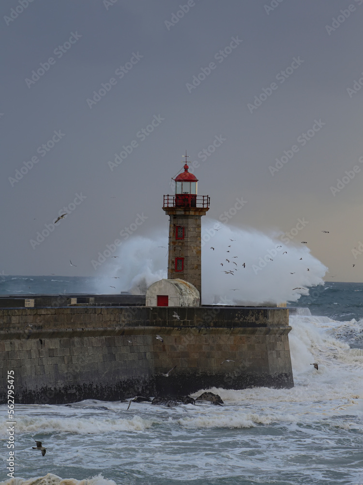 Oldlighthouse in a stormy dusk