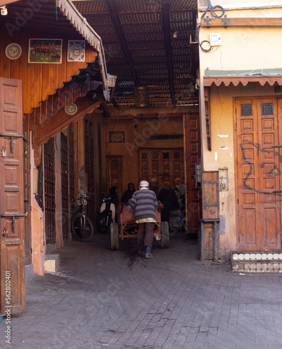A picture captures an old man walking through the streets of Marrakesh © conor
