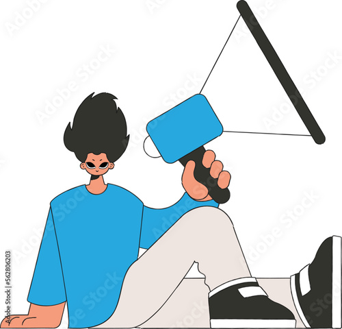 A young guy sits on the floor and holds a megaphone.