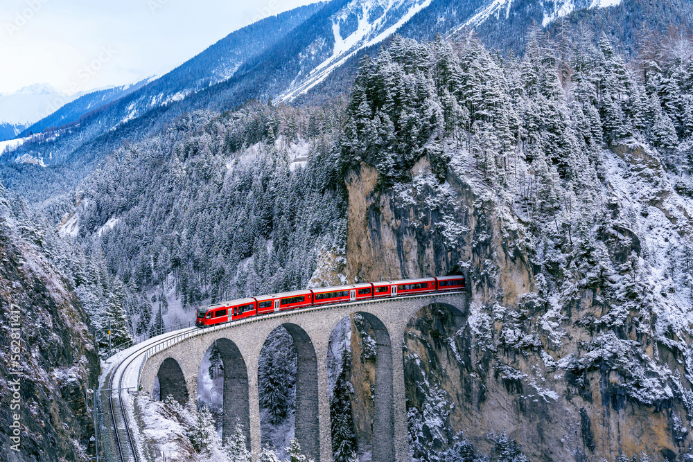 Aerial view of Train passing through famous mountain in Filisur ...