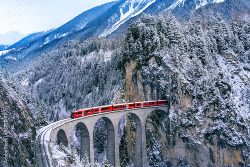 Murais de parede Aerial view of Train passing through famous mountain in Filisur, Switzerland