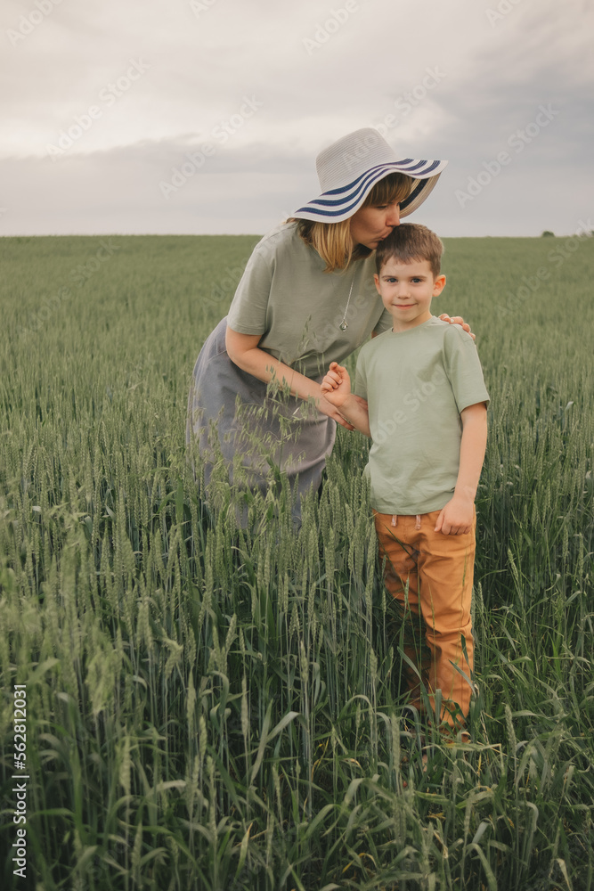 mom and son in the field. happy family mom and son in the field. happy family
