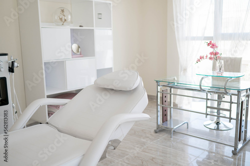 The white room, cabinet, class wirh orchid flower, beauty room, cosmetology class © Galina