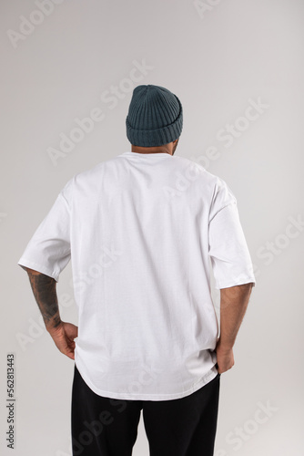 African american man in a hat and white t-shirt.