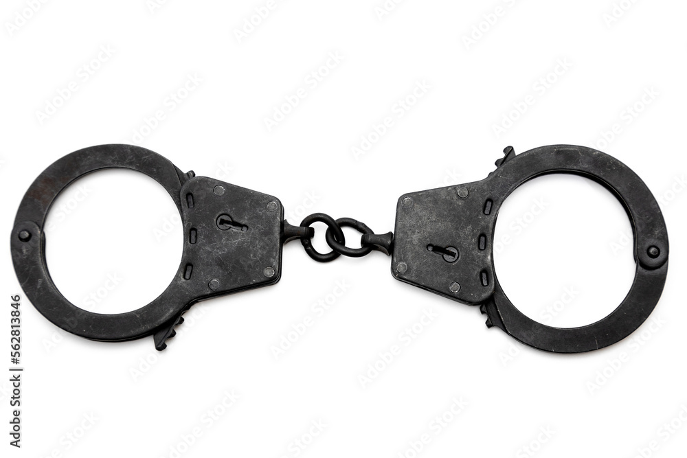 metal police handcuffs in black on a white background metal police handcuffs in black on a white background