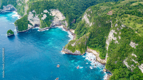 Beautiful coastline aerial view from Saren Cliff Point. Clear water and rocks with cloudy sky. Nusa Penida, Indonesia. © umike_foto