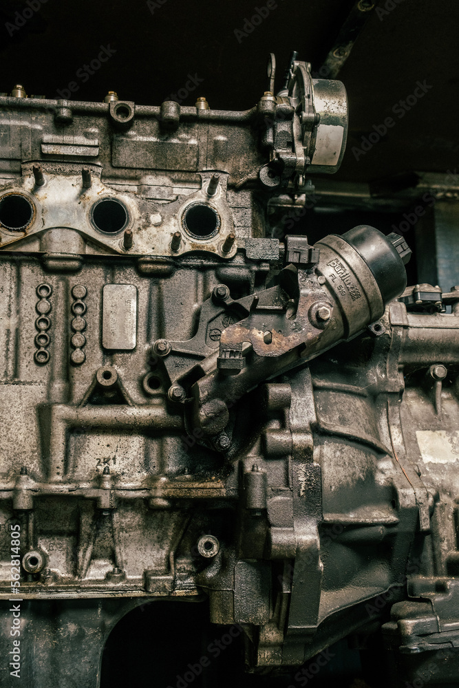 Close up detail of a car engine in a mechanic shop for repair