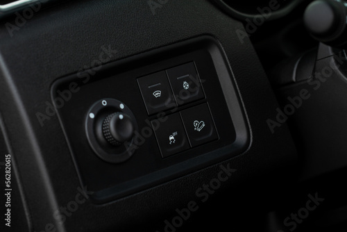 Windshield defrost button. Modern car interior details. Windshield heating close up view.
