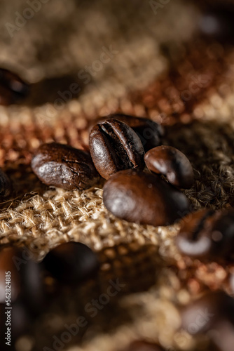 Roasted Coffee Beans on Burlap Sack Background