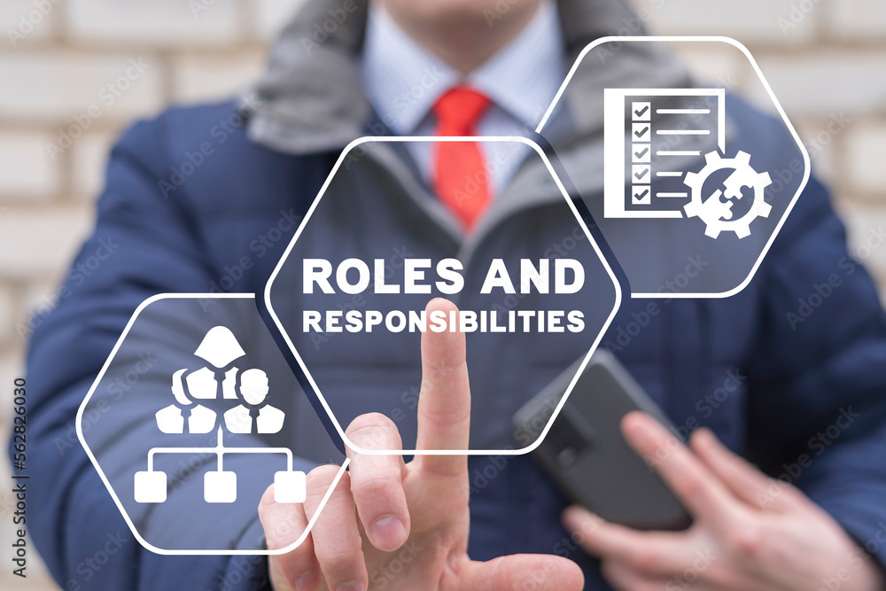 Businessman using virtual touchscreen presses the inscription: ROLES Businessman using virtual touchscreen presses the inscription: ROLES