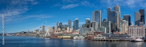Seattle, Washington - Jan. 23 Panoramic view of Seattle Downtown Skyline with modern skyscrapers , Waterfront with piers, The Seattle Great Wheel and  Space Needle. View from Elliott Bay Seaside.    © Mario Hagen