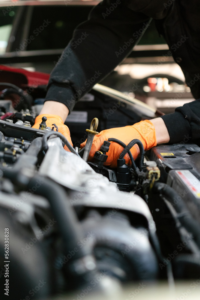 Car mechanic working in a garage Car mechanic working in a garage