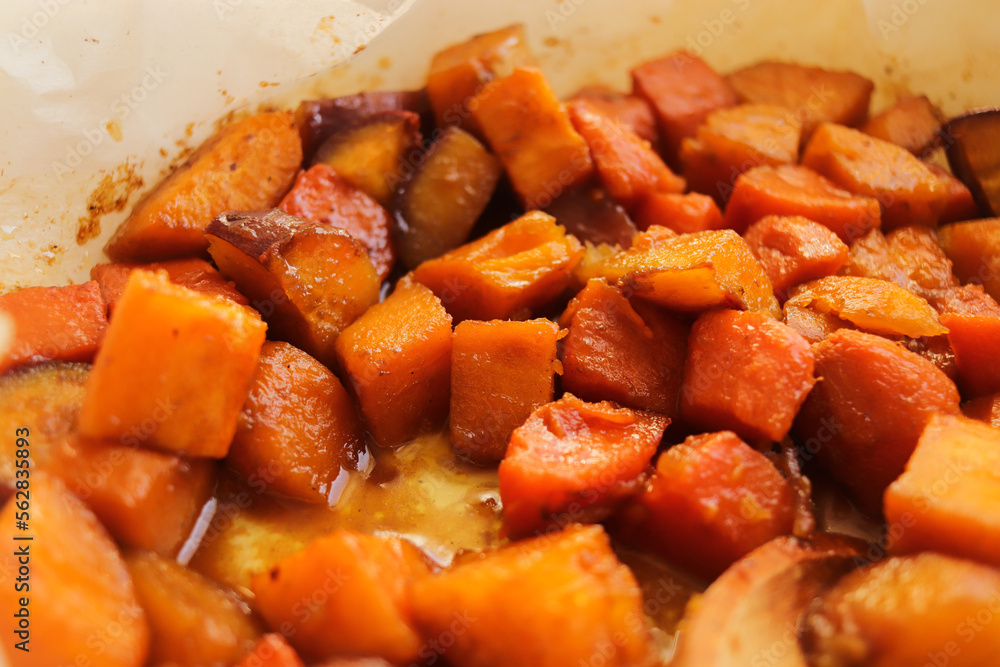 diced sweet potato baked in the oven on a baking sheet
