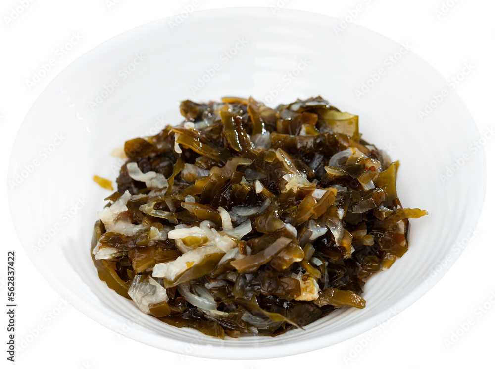Healthy salad from marinated seaweed and onion served in plate. Isolated over white background