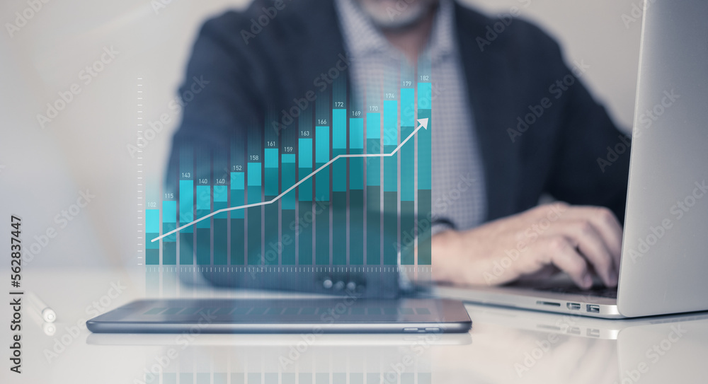Businessman using laptop analyzing sales chart and economic growth. Business marketing strategy. - obrazy, fototapety, plakaty 