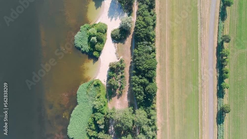 Aerial top down drone shot of a lake and a beach in Zeewolde, The Netherlands photo